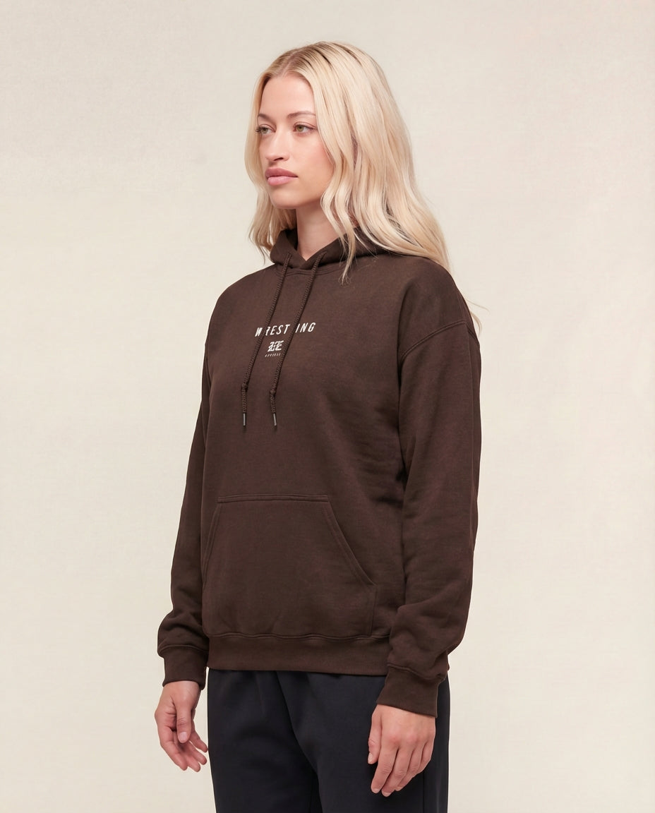 Person wearing a Brown hoodie with text on a beige background