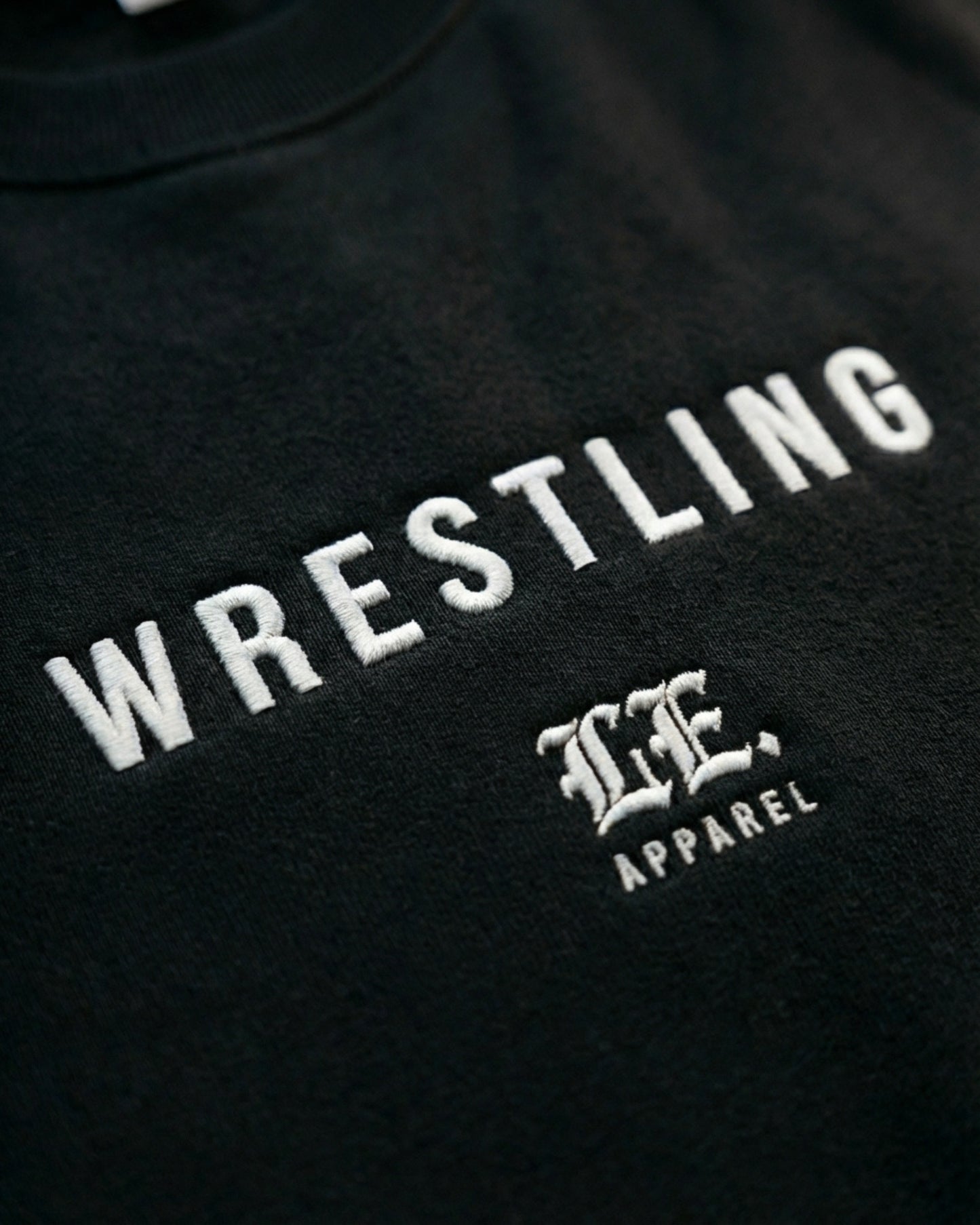Black sweatshirt with 'Wrestling' and a logo on a black background