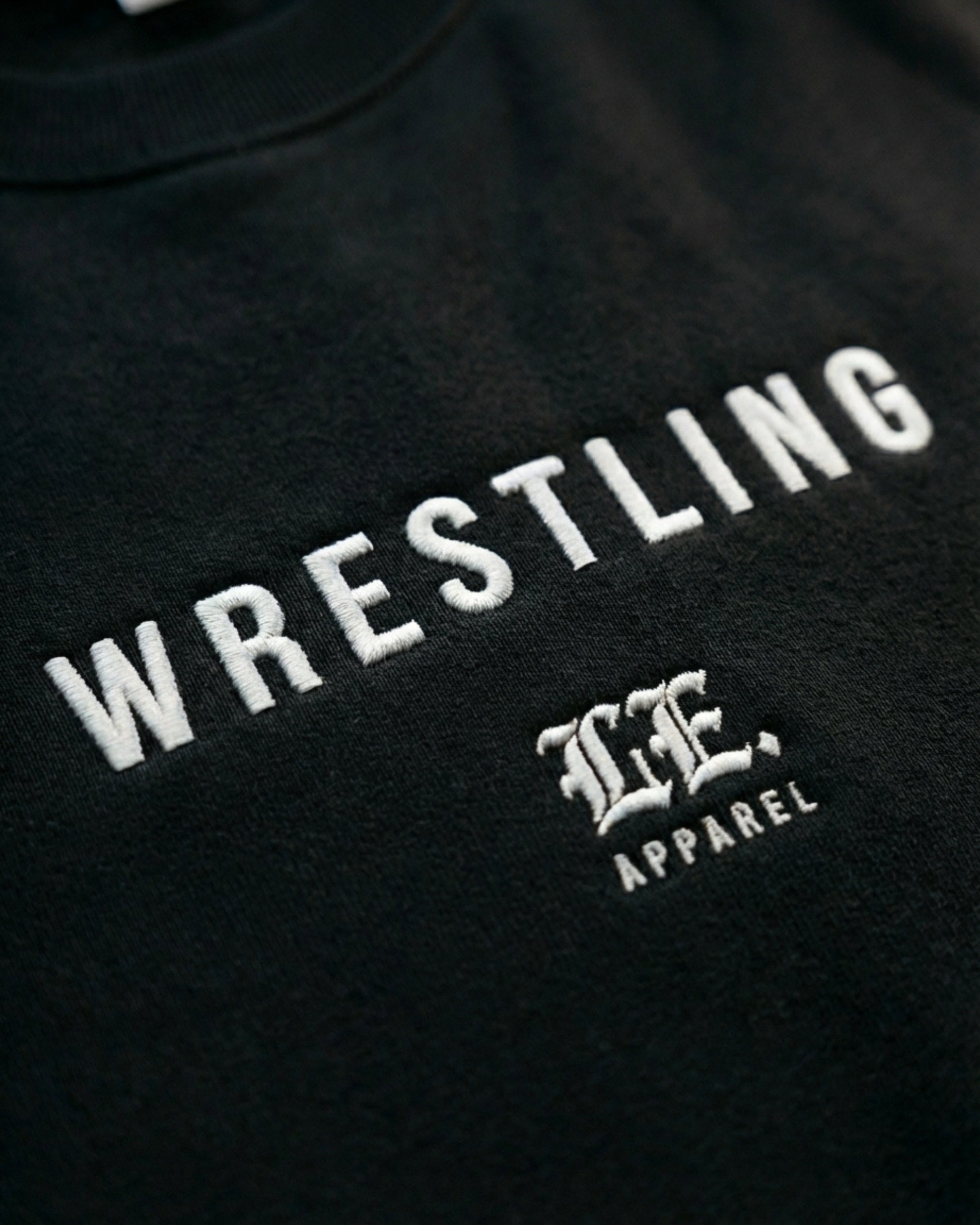 Black sweatshirt with 'Wrestling' and a logo on a black background