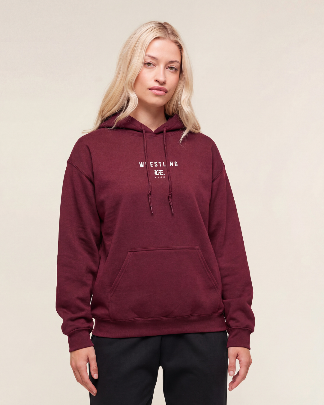 Person wearing a Maroon hoodie with text on a beige background